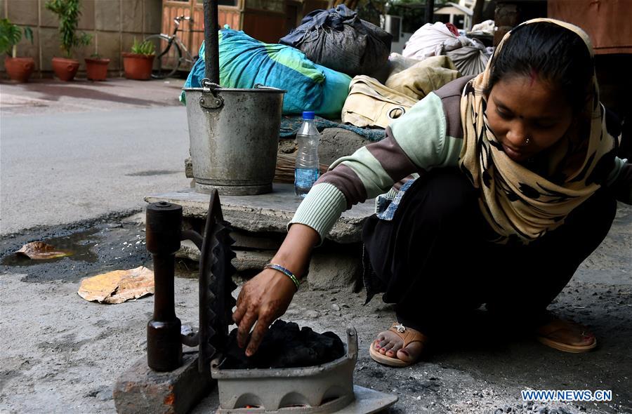 INDIA-NEW DELHI-CLOTHES-IRONING STAND