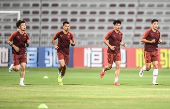 Players of China and Syria attend training sessions before group A match